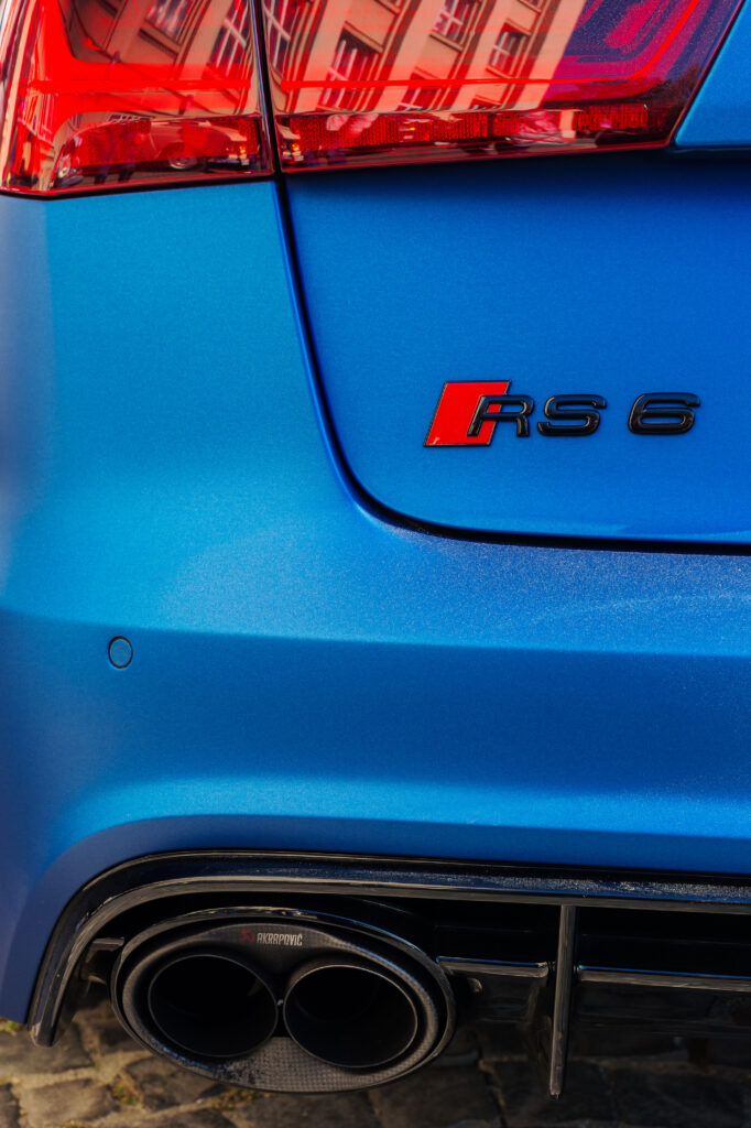 rear close-up view of audi quattro rs6 car muffler and tail lights